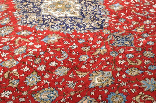 Backside of handmade 1970s Ghom rug showing knot structure and weave density