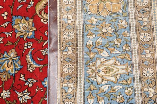 Surface texture of 1970s Ghom rug with natural Wool and intricate pattern