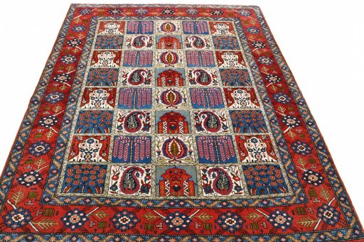 Surface texture of 1950s Ghom rug with natural Wool and intricate pattern
