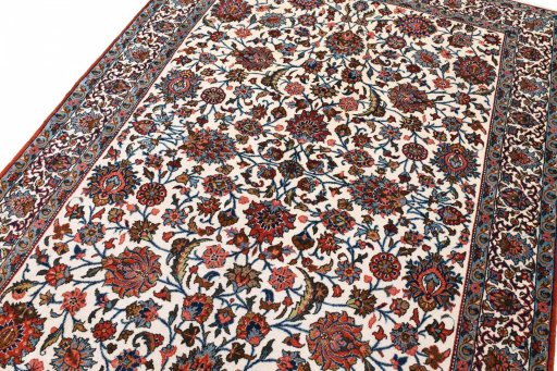 Backside of handmade 1950s Ghom rug showing knot structure and weave density