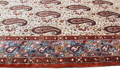 Surface texture of 1950s Ghom rug with natural Wool and intricate pattern
