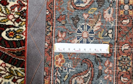 Close-up detail of 1950s Ghom rug from Iran / Persia showing Wool weave