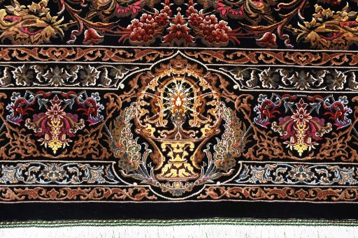Backside of handmade New Ghom rug showing knot structure and weave density