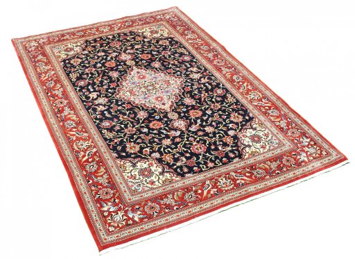 Corner detail of 2000s Ghom rug showing border pattern and Cork pile