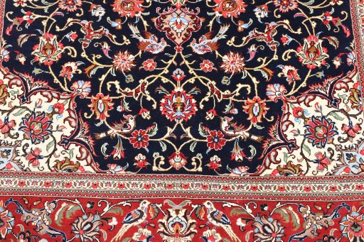 Backside of handmade 2000s Ghom rug showing knot structure and weave density