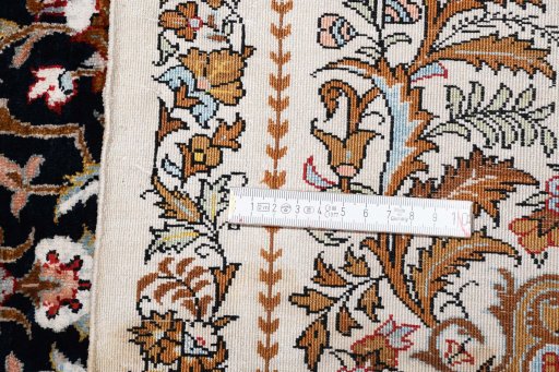 Backside of handmade New Ghom rug showing knot structure and weave density