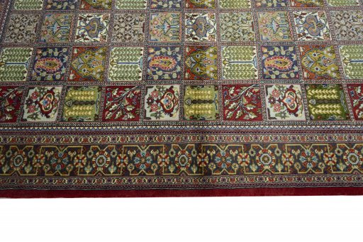 Close-up detail of 2000s Ghom rug from Iran / Persia showing Wool weave
