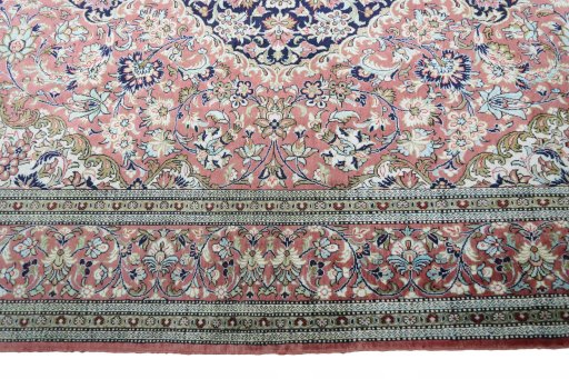 Corner detail of 1970s Ghom rug showing border pattern and Silk pile