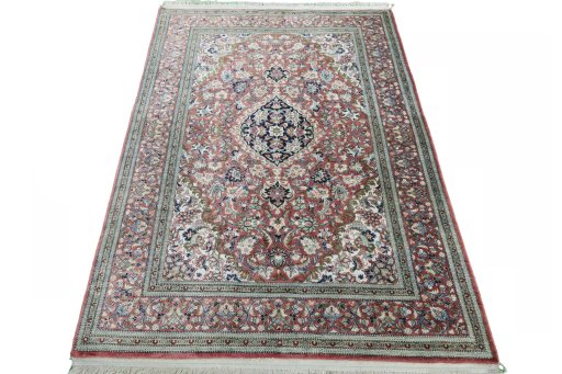 Surface texture of 1970s Ghom rug with natural Silk and intricate pattern