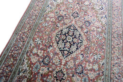 Backside of handmade 1970s Ghom rug showing knot structure and weave density