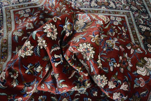 Surface texture of 1970s Ghom rug with natural Silk and intricate pattern
