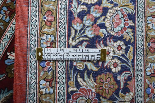 Backside of handmade 1970s Ghom rug showing knot structure and weave density