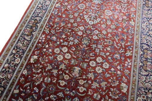 Backside of handmade 1970s Ghom rug showing knot structure and weave density