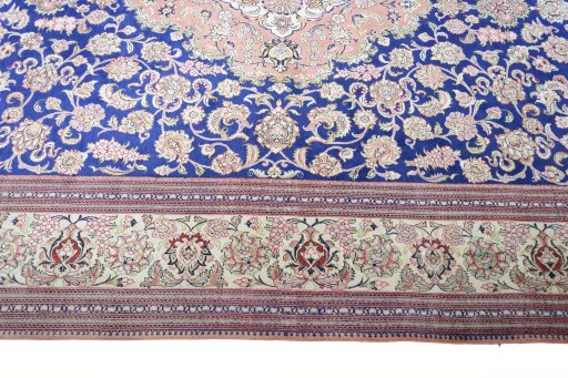 Corner detail of 2000s Ghom rug showing border pattern and Silk pile