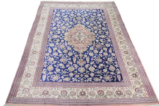 Surface texture of 2000s Ghom rug with natural Silk and intricate pattern