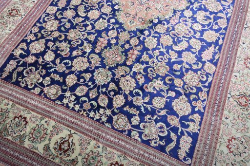 Close-up detail of 2000s Ghom rug from Iran / Persia showing Silk weave