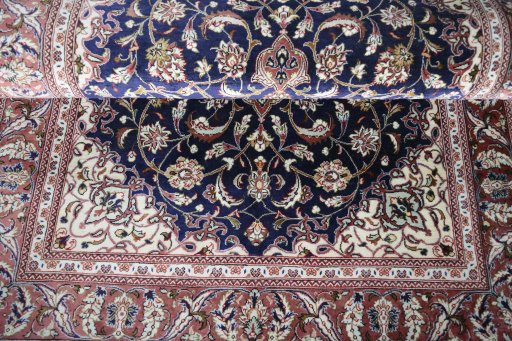 Close-up detail of 2000s Ghom rug from Iran / Persia showing Silk weave