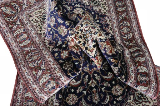Surface texture of 2000s Ghom rug with natural Silk and intricate pattern