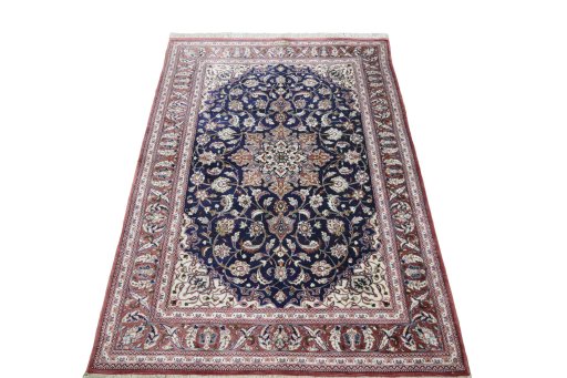 Surface texture of 2000s Ghom rug with natural Silk and intricate pattern