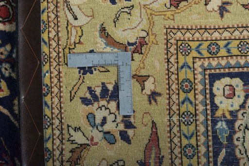 Backside of handmade New Ghom rug showing knot structure and weave density