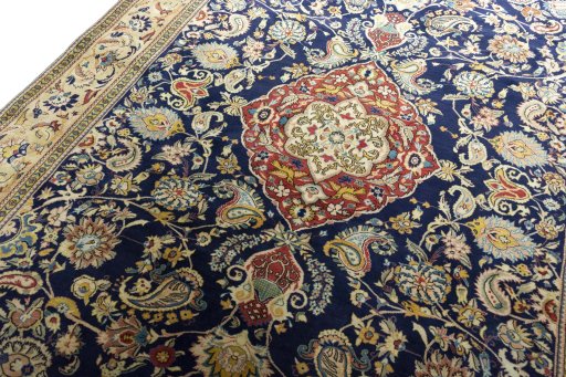 Backside of handmade New Ghom rug showing knot structure and weave density