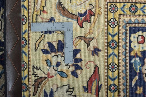 Backside of handmade New Ghom rug showing knot structure and weave density
