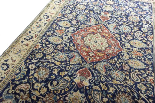 Backside of handmade New Ghom rug showing knot structure and weave density