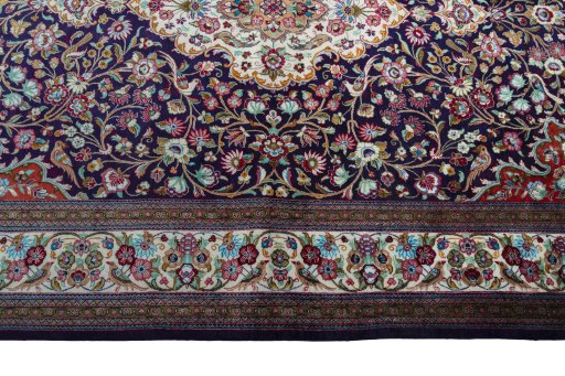 Corner detail of 1970s Ghom rug showing border pattern and Silk pile