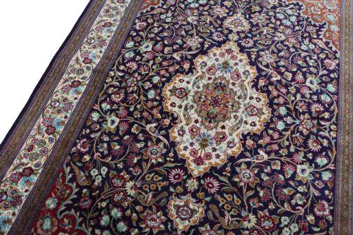 Backside of handmade 1970s Ghom rug showing knot structure and weave density