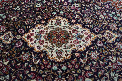 Central medallion detail of 1970s Ghom rug from Iran / Persia