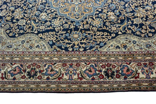 Corner detail of 1970s Ghom rug showing border pattern and Cork pile