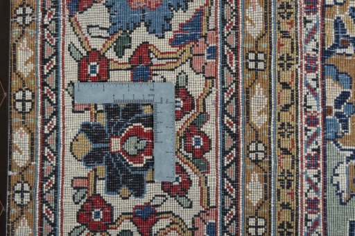 Backside of handmade 1970s Ghom rug showing knot structure and weave density