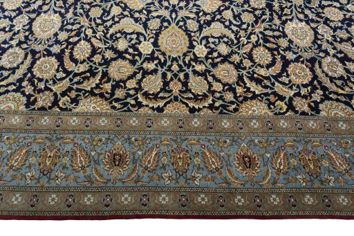 Corner detail of 1950s Ghom rug showing border pattern and Cork pile