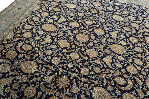 Backside of handmade 1950s Ghom rug showing knot structure and weave density