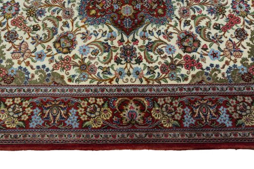Corner detail of 2000s Ghom rug showing border pattern and Cork pile