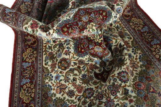 Surface texture of 2000s Ghom rug with natural Cork and intricate pattern