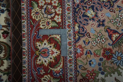Backside of handmade 2000s Ghom rug showing knot structure and weave density