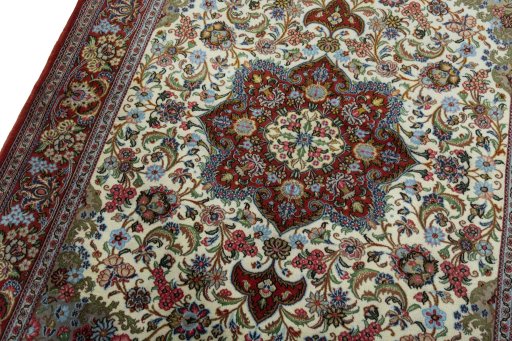 Backside of handmade 2000s Ghom rug showing knot structure and weave density