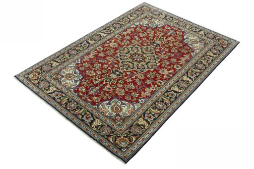 Corner detail of 2000s Ghom rug showing border pattern and Cork pile