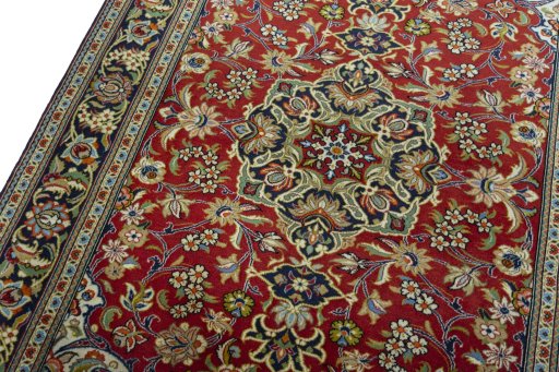 Backside of handmade 2000s Ghom rug showing knot structure and weave density