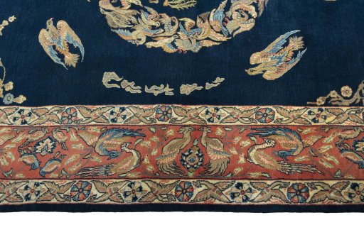 Corner detail of 1970s Ghom rug showing border pattern and Wool pile
