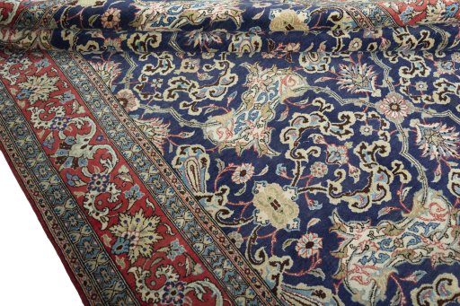 Corner detail of 1970s Ghom rug showing border pattern and Cork pile
