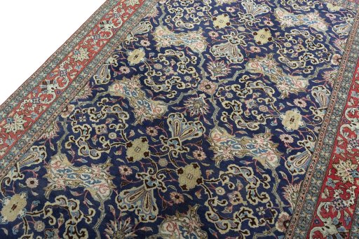 Backside of handmade 1970s Ghom rug showing knot structure and weave density