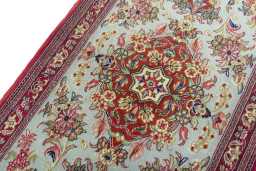Backside of handmade New Ghom rug showing knot structure and weave density