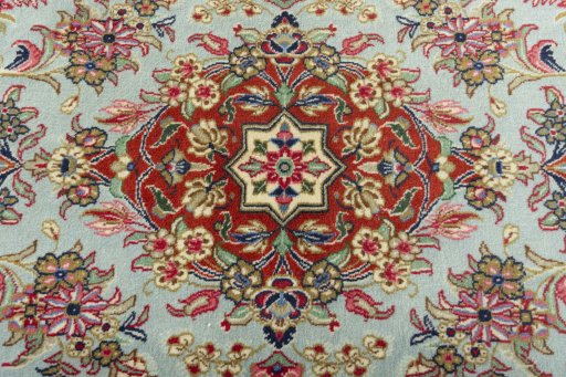 Central medallion detail of New Ghom rug from Iran / Persia
