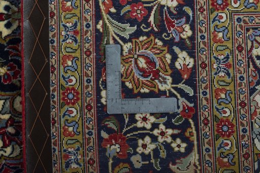 Backside of handmade New Ghom rug showing knot structure and weave density