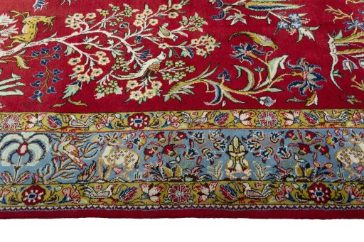 Corner detail of 1970s Ghom rug showing border pattern and Wool pile