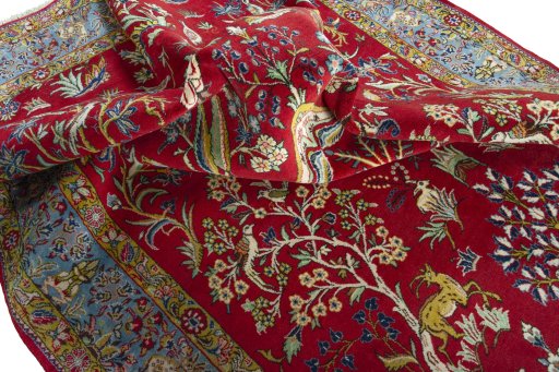 Surface texture of 1970s Ghom rug with natural Wool and intricate pattern
