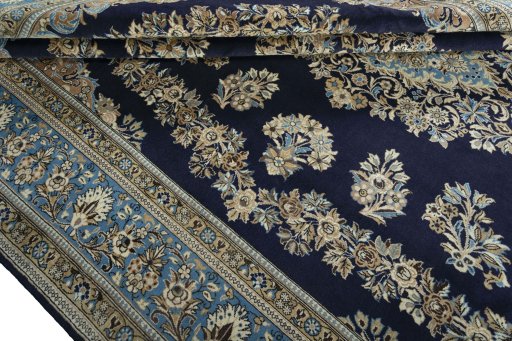 Close-up detail of 2000s Ghom rug from Iran / Persia showing Wool weave