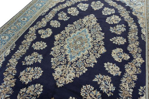 Backside of handmade 2000s Ghom rug showing knot structure and weave density